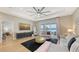 Bright living room with modern furnishings, waterfront views, and sliding glass doors to the outdoor space at 12708 Aquamarine Ave, Bradenton, FL 34211