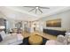 Open-concept living area with stylish furnishings, and views of the kitchen, dining area, and backyard at 12708 Aquamarine Ave, Bradenton, FL 34211