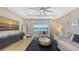 Bright living room with modern furnishings, waterfront views, and sliding glass doors to the outdoor space at 12708 Aquamarine Ave, Bradenton, FL 34211