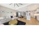 Open-concept living area with stylish furnishings, and views of the kitchen, dining area, and backyard at 12708 Aquamarine Ave, Bradenton, FL 34211