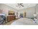 Comfortable main bedroom featuring a king bed, modern decor, and a dressing table with a vanity at 12708 Aquamarine Ave, Bradenton, FL 34211