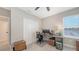 Bright office space with a large window, closet, and a modern desk setup at 12708 Aquamarine Ave, Bradenton, FL 34211