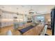 Bright open floor plan featuring a modern kitchen, dining area, and comfortable living space at 12708 Aquamarine Ave, Bradenton, FL 34211