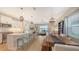 Bright open floor plan featuring a modern kitchen, dining area, and comfortable living space at 12708 Aquamarine Ave, Bradenton, FL 34211