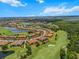 An aerial view of a residential community with a golf course and lakes at 13810 Messina Loop # 202, Bradenton, FL 34211