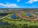 Aerial view of homes surrounded by golf course and lakes in a residential community at 13810 Messina Loop # 202, Bradenton, FL 34211