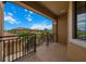 Inviting balcony view overlooking lush treetops and terracotta rooftops under a bright, sunny sky at 13810 Messina Loop # 202, Bradenton, FL 34211