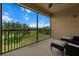 Serene outdoor balcony with golf course view, perfect for enjoying Florida's sunny weather at 13810 Messina Loop # 202, Bradenton, FL 34211