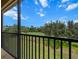 Outdoor balcony with a picturesque view of the lush green golf course and blue sky at 13810 Messina Loop # 202, Bradenton, FL 34211