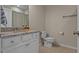 Cozy bathroom featuring white cabinets, granite countertop and modern decor at 13810 Messina Loop # 202, Bradenton, FL 34211