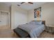 Well-lit bedroom featuring a large window, modern art on the wall and closet with sliding doors at 13810 Messina Loop # 202, Bradenton, FL 34211
