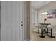 Charming dining nook features a table with modern seating, bathed in natural light from the window at 13810 Messina Loop # 202, Bradenton, FL 34211