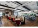 A dining room featuring booths, tables for four, and a view of the golf course at 13810 Messina Loop # 202, Bradenton, FL 34211