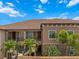 Exterior of building with stairs leading to upper units and palm trees at 13810 Messina Loop # 202, Bradenton, FL 34211