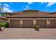 Four garage doors with stone accents in a brick paver driveway at 13810 Messina Loop # 202, Bradenton, FL 34211