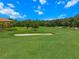 Golf course view surrounded by sand traps, lush greens and landscaping at 13810 Messina Loop # 202, Bradenton, FL 34211