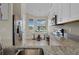 Kitchen features stainless appliances, granite counters, with a breakfast nook and lots of natural light at 13810 Messina Loop # 202, Bradenton, FL 34211