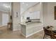 Open kitchen design features granite counters, white cabinetry, and a convenient breakfast bar at 13810 Messina Loop # 202, Bradenton, FL 34211