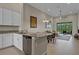 Open kitchen design with granite countertops, stainless steel dishwasher, and seamless flow to living area at 13810 Messina Loop # 202, Bradenton, FL 34211