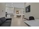 Open-concept living space with kitchen, dining, and office areas with modern décor and tiled floors at 13810 Messina Loop # 202, Bradenton, FL 34211