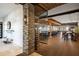 Spacious restaurant interior featuring a wine rack, bar seating, and wood beam accents at 13810 Messina Loop # 202, Bradenton, FL 34211