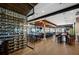 Elegant restaurant interior with a wine rack, dining tables, and open floor plan at 13810 Messina Loop # 202, Bradenton, FL 34211