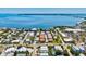 Scenic aerial shot of a waterfront neighborhood, featuring homes near a bay and lush greenery at 145 50Th St, Holmes Beach, FL 34217