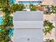 Aerial shot of houses with pools and tropical vegetation showcasing rooftops and pool areas at 145 50Th St, Holmes Beach, FL 34217