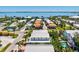 Coastal neighborhood showing multiple homes with neatly manicured landscapes and a clear view of the ocean at 145 50Th St, Holmes Beach, FL 34217