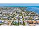 Panoramic aerial view of a coastal town with homes and businesses along a beautiful shoreline at 145 50Th St, Holmes Beach, FL 34217