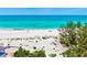 Beautiful beachfront with white sand and clear blue waters, seen from an aerial perspective at 145 50Th St, Holmes Beach, FL 34217