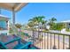 Relaxing balcony with tropical views and Adirondack chairs, perfect for enjoying the outdoors at 145 50Th St, Holmes Beach, FL 34217