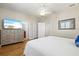 Bedroom featuring a TV, hardwood floors, natural light, and multiple doors at 145 50Th St, Holmes Beach, FL 34217