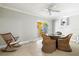 Relaxing dining room with glass table, woven chairs and view of pool area at 145 50Th St, Holmes Beach, FL 34217