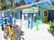 Beachfront convenience store with eye-catching ice cream decor, easy bike parking for beachgoers at 145 50Th St, Holmes Beach, FL 34217
