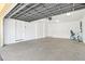 Spacious two car garage with white walls, concrete floors, and ample room for vehicles and storage at 145 50Th St, Holmes Beach, FL 34217
