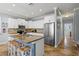 The kitchen features a large island, stainless steel appliances, and ample cabinet space at 145 50Th St, Holmes Beach, FL 34217