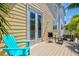 Inviting outdoor patio featuring a seating area and charming French doors to let the outdoors in at 145 50Th St, Holmes Beach, FL 34217