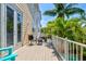Inviting outdoor patio featuring a seating area and charming French doors to let the outdoors in at 145 50Th St, Holmes Beach, FL 34217