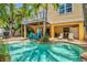 Sparkling pool with sun deck, brick patio, lounge chairs, BBQ, and covered outdoor seating area at 145 50Th St, Holmes Beach, FL 34217