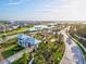 Aerial view of a gated community featuring a lake, lush greenery, and well-maintained streets at 14835 Lyla Ter, Bradenton, FL 34211