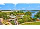 Stunning aerial view of a waterfront restaurant and lounge nestled amidst lush greenery and picturesque lake scenery at 14835 Lyla Ter, Bradenton, FL 34211