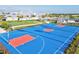 Modern basketball court with vibrant blue surface, perfect for outdoor games and community events at 14835 Lyla Ter, Bradenton, FL 34211