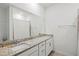 A well-lit bathroom features a long countertop with a mirror, a sink, and a shower at 14835 Lyla Ter, Bradenton, FL 34211