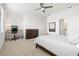 Bright bedroom featuring a work area, dresser, and a door leading to a bathroom at 14835 Lyla Ter, Bradenton, FL 34211