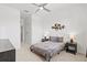 Well-lit bedroom with modern decor, including an accent wall art piece and neutral color at 14835 Lyla Ter, Bradenton, FL 34211