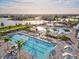 Aerial view of the community pool area, showcasing multiple pools, seating, and palm trees at 14835 Lyla Ter, Bradenton, FL 34211