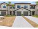 Charming townhome featuring an attached garage and a well-manicured front yard at 14835 Lyla Ter, Bradenton, FL 34211