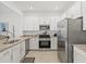 Bright kitchen with granite countertops, stainless steel appliances, and ample cabinet space at 14835 Lyla Ter, Bradenton, FL 34211