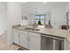 Stylish kitchen featuring granite countertops, stainless steel dishwasher, and neutral color palette at 14835 Lyla Ter, Bradenton, FL 34211